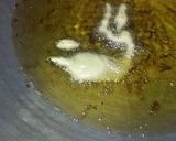 A picture of step 4 of Masaly bhari hari mirch k pakoray.