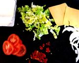 A picture of step 1 of My Chilli Burger with lots of toppings 😘.