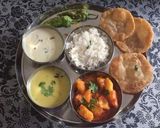 A picture of step 22 of BOILED POTATO CURRY SERVED WITH KADHI, PURI, AND KHEER.