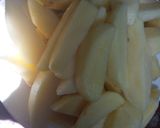 A picture of step 1 of Rosemary baked potato wedges.