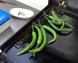 Une image de l'étape 4 de Travers de porc grillés marinade tomates et épices (et piments verts recette plancha).
