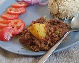 A picture of step 7 of Karahi qeema matar with brown onion rice.