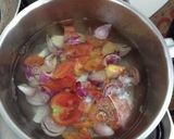 A picture of step 3 of Dinengdeng with fried fish.