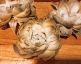 A picture of step 5 of Grilled Artichokes with Garlic, Oil, and Parsley Dressing.