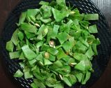 A picture of step 1 of Broad Beans and Potato Curry.