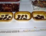 A picture of step 3 of Yummy Oreo white chocolates in cups.