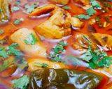 A picture of step 7 of Arvi Gosht with chapati.