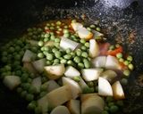 A picture of step 10 of Peas Tomato Potato Curry.