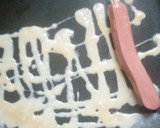 A picture of step 4 of Stick egg net sausage.