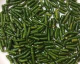 A picture of step 1 of Green chilli pickle.