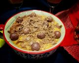 A picture of step 8 of Doodh daliya in pressure cooker (with different toppings).