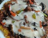 Foto del paso 7 de la receta: Pizza de champiñones y pimientos con masa de zanahoria y coliflor🍕🧀🍳🥕🍄‍🟫🫑