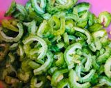 A picture of step 1 of Piyaz Karela.
