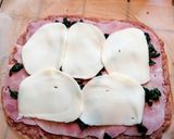 A picture of step 2 of Meat Pinwheels with Ham, Cheese, and Spinach.