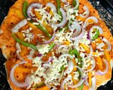 A picture of step 5 of Pizza with fresh pizza dough.