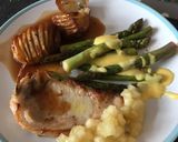 A picture of step 6 of Brined Pork Chops with Hasselback Potatoes, tender, buttery Asparagus and sharp Hollandaise Sauce.