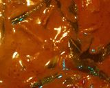 A picture of step 4 of Ulli theeyyal (shallots cooked in roasted coconut gravy and tamarind juice).