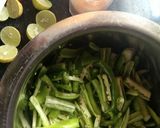 A picture of step 2 of Green chilli pickles.