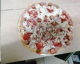 A picture of step 4 of Choma sausage pizza.