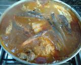 Foto del paso 7 de la receta Merluza con almejas y langostinos