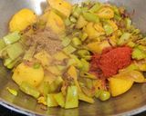 A picture of step 6 of Sem Aloo with Kalonji Seeds.