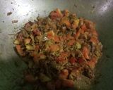 A picture of step 9 of Baingan bharta (smoked eggplant with spices).