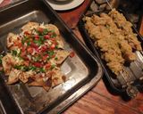 A picture of step 3 of Chicken satay kebabs and home made pili pili cheesy chapati nachos in the jiko oven :).