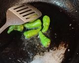 A picture of step 1 of Achari Aloo Baingan.