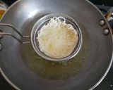 A picture of step 3 of Schezwan noodles in noodles basket with kiwi banana smoothie.