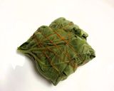 A picture of step 4 of Lau Patay Kacha Kolar Paturi (Raw Banana steam cooked in Bottle Gourd Leaves - Bong style).