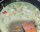 A picture of step 3 of Green Thai curry with steamed rice.
