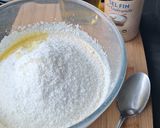 Une image de l'étape 3 de Cake ricotta, noix de coco et confiture à la mangue.