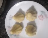 A picture of step 3 of Stuffed gulkand and coconut jaggery rava modak.