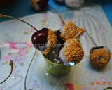 A picture of step 3 of White Chocolate dipped Cherries.
