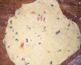 A picture of step 2 of Patheera with onion sauce.