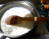 A picture of step 7 of Italian panner ravioli with pink sauce.