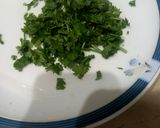 A picture of step 1 of Omelette with green coriander 🥚🥬🥬.