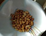 A picture of step 2 of Tomato sautéed bean cake and groundnut rice puddy.