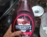 A picture of step 2 of Hershey's chocolate and cocoa milk shake.