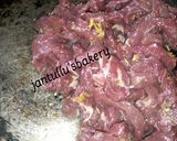 A picture of step 7 of Kilishi rice and green shredded beef.