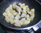 A picture of step 1 of Aloo with Spring Onion.