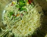 A picture of step 2 of Cheesy Maggi vegetable cake.