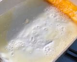A picture of step 4 of Japanese white and yellow Egg Roll.