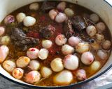 A picture of step 5 of Beef Stifado in a Dutch Oven.