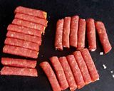 A picture of step 5 of My cheese wrapped in Pepperoni and Savoury Crackers 🤩.