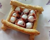 A picture of step 4 of Cacio and pepe breadsticks with prosciutto and goat's cheese.
