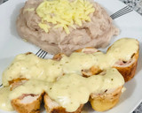 Foto del paso 5 de la receta: Rollitos de pechuga de pollo bañados en salsa bechamel con queso