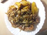 Turkey Steak Served with Potato Wedges and Black pepper mushroom sauce