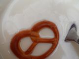 sweet brezel on red-white day