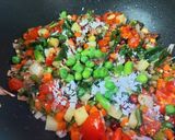 A picture of step 3 of Tangy Tomato Coconut and Mixed Veggies Poha.